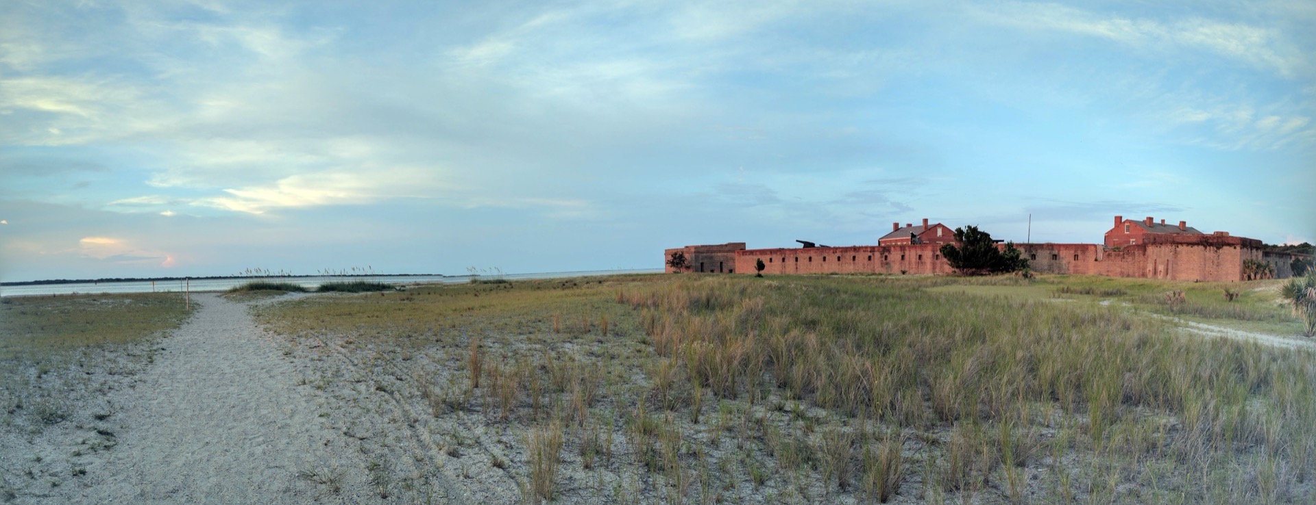 Panoramic view of Fort Clinch's brick fortifications with coastal dunes and beach stretching into the distance